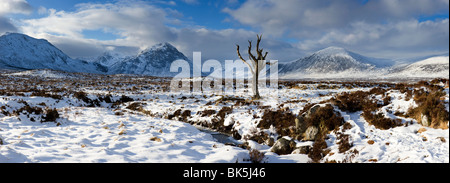 Panoramic view over snow-covered Rannoch Moor towards distant mountains, Highland, Scotland, UK Stock Photo