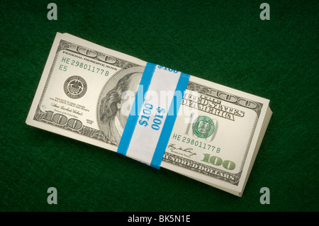 stacks of money on green Stock Photo