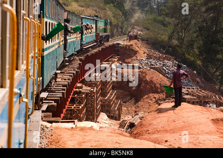 India, Tamil Nadu, Udhagamandalam (Ooty), Nilgiri Mountain Railway rack train crossing temporary bridge over damaged track Stock Photo