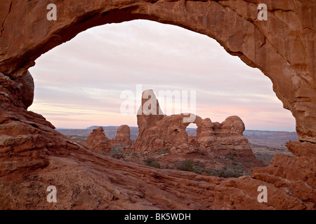 Turret Arch through North Window at dawn, Arches National Park, Utah, United States of America, North America Stock Photo