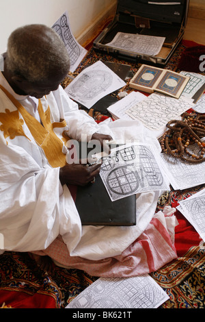 Marabout at work, Mbour, Thies, Senegal, West Africa, Africa Stock Photo