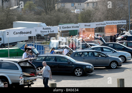 People recyling rubbish and waste at council recycling centre Stock Photo