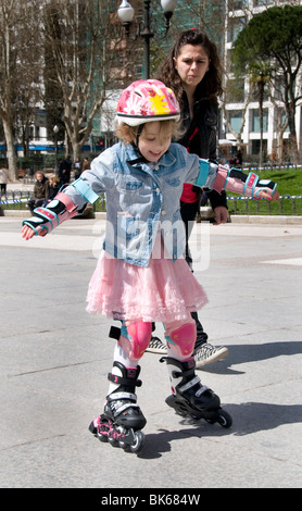 Plaze de Espana Madrid Spain little girl child inline roller skating skate skates Stock Photo