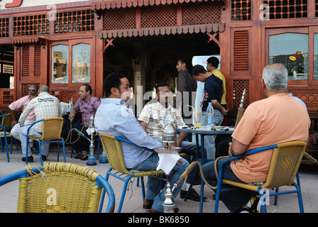 Egyptian men smoking hookahs in a cafe in Hurghada Stock Photo