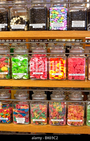 Candy jars on the shelves in a candy store Stock Photo