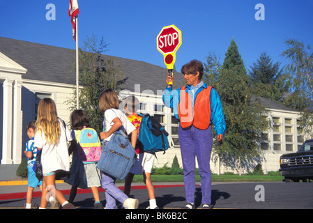 released woman school crossing traffic guard Stock Photo