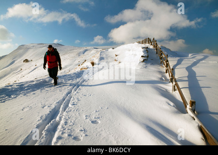 Walker in the snow, Mam Tor, Peak District National Park, UK, England Stock Photo
