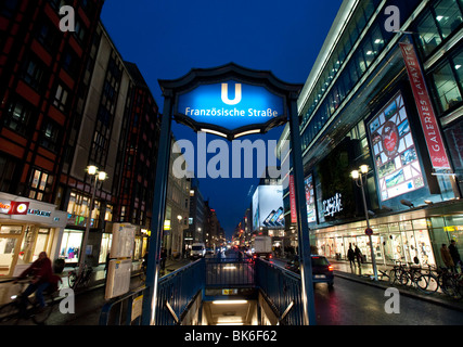 View of Friedrichstrasse at night at entrance to Franzosische Strasse subway station in Mitte Berlin Germany Stock Photo