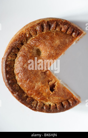 A pork pie with a wedge cut out of it Stock Photo