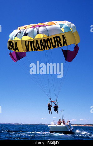 Holiday makers taking part in parascending activities off the coast of Vilamoura, in Portugal's Algarve province Stock Photo