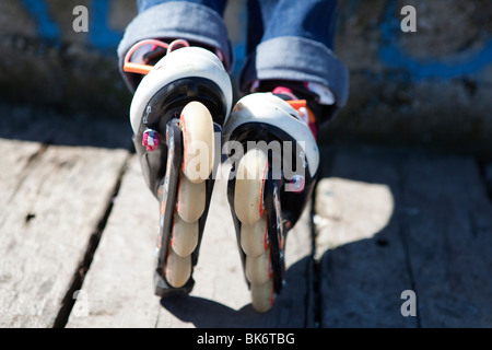 IN LINE ROLLER SKATE CLOSE UP ON WHEELS Stock Photo