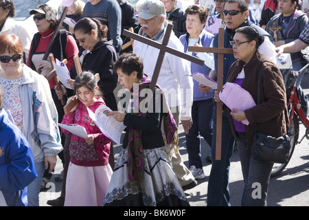 Roman Catholics of various ethnic groups participate on Good Friday in a procession of 'The Stations of the Cross' Stock Photo