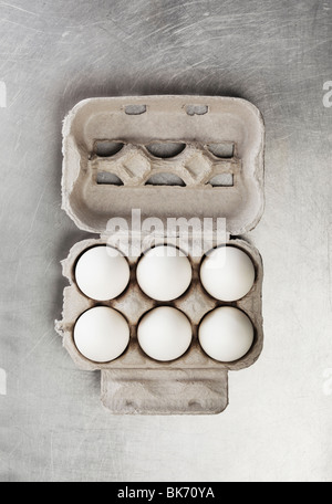 Six chicken eggs in a carton Stock Photo