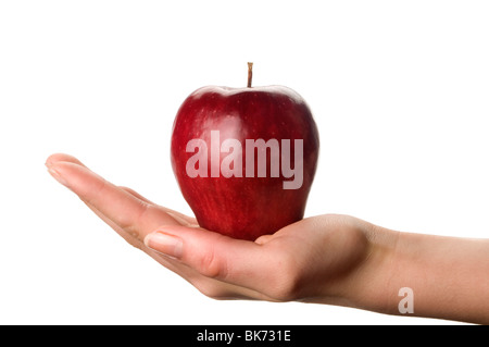 hand holding red apple against white background Stock Photo
