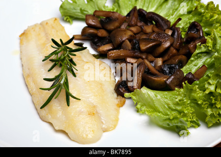 Grilled sole fish with mushrooms and herb Stock Photo