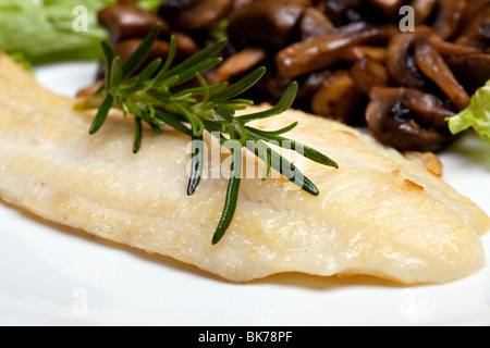 Grilled sole fish with mushrooms and herb Stock Photo