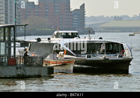 Thames Clippers riverboat at Canary Wharf pier jetty , London E14, United Kingdom Stock Photo