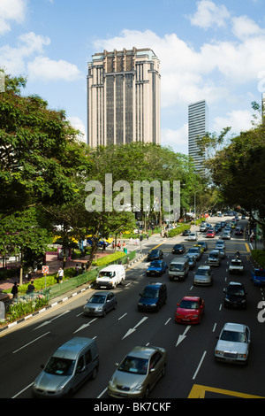 Traffic and tall buildings on North Bridge Road in Singapore Stock Photo