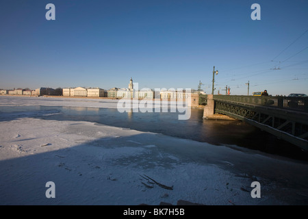 Palace Bridge over Neva River with Kunstkamera on the opposite bank, in winter, Saint Petersburg Russia Stock Photo