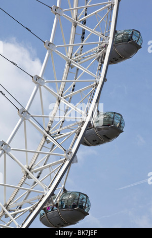 Looking up at Pods of the London Eye with a blue sky backdrop Stock Photo