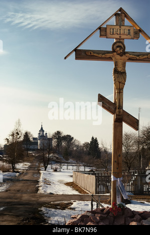 A wooden crucifix on the road to the Tryhirskyy Saviour - Transfiguration Monastery in Zhytomyr Stock Photo