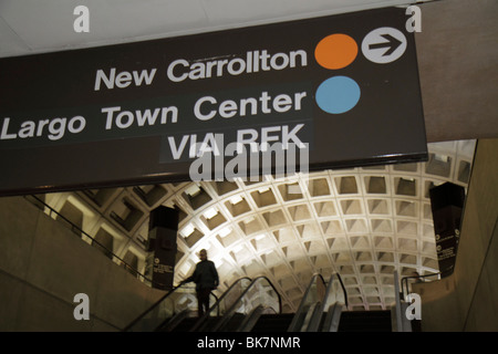 Washington DC,9th Street NW,Gallery Place Metro Station system,sign,direction,New Carrollton,Largo Town Center,blue,orange line,ceiling,escalator,DC10 Stock Photo