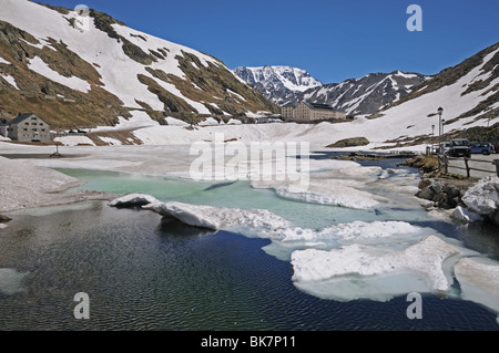 Great St Bernard Hospice and frozen lake at top of Saint Bernard Pass between Aosta Italy and Martigny Switzerland Stock Photo