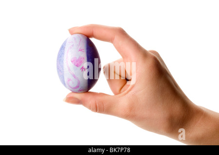 hand holding easter colored egg Stock Photo