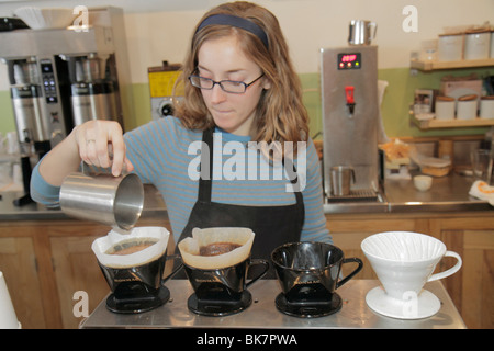 Washington DC,Eastern Market,7th Street NE,coffee shop,barista,woman female women,brewing,slow drip,caffeine,DC100221015 Stock Photo