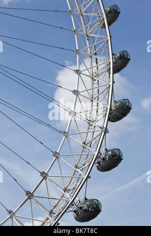 Looking up at Pods of the London Eye with a blue sky backdrop Stock Photo