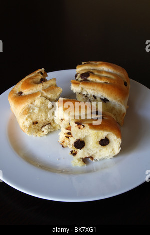 Chocolate Chip French Brioche Bread on a White Plate with dark background Stock Photo