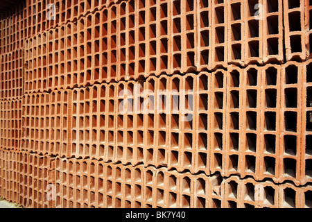 construction bricks stacked pattern red clay  Stock Photo
