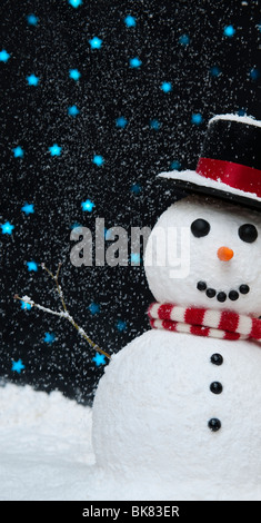 Snowman in the snow against starry night sky concept Stock Photo - Alamy