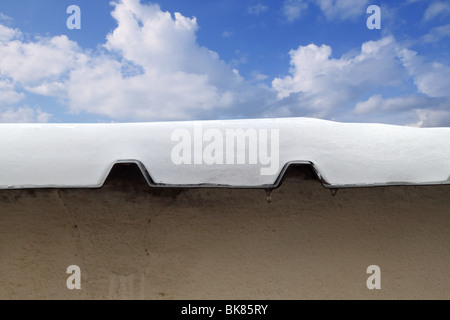 metal snow roof meltwater cross section blue sky Stock Photo