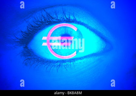 Close-up of an eye with the EURO symbol, symbolic picture for greed Stock Photo