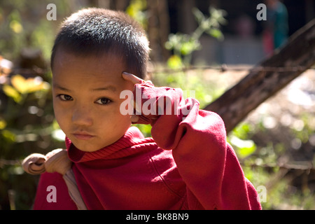 A young Karen Refugee boy in the Mae La Refugee Camp  for Burmese refugees in Northern Thailand. Stock Photo