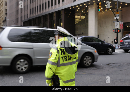 A New York Police Department (NYPD) policeman directing traffic on Broadway in Lower Manhattan. Stock Photo