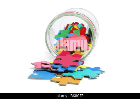 Jigsaw Puzzle Pieces in Glass Jar Stock Photo