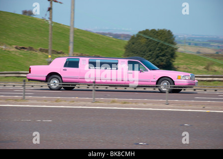 Pink stretched limo on the M62 (near Outlane). Stock Photo