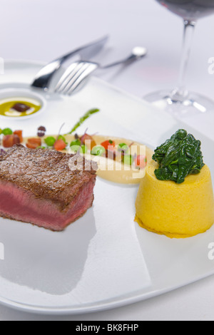 Steak served with condiments Stock Photo