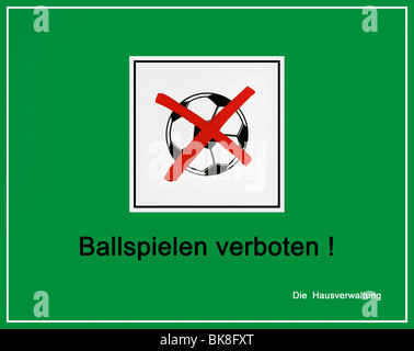 Green sign, information board, crossed out football, 'Ball games prohibited! Property Management' Stock Photo