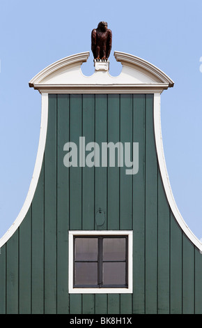Neck pediment with eagle, typical wooden house from the 17th century, historic city De Rijp near Alkmaar, Province of North Hol Stock Photo