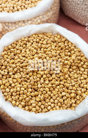 Double Roasted Chickpeas and Garbanzo beans in bags of dry produce (nuts, seeds and spices) from the market Stock Photo