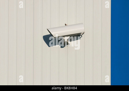 Surveillance camera on hall wall Stock Photo