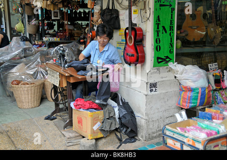 Tailoress working on a street, Bangkok, Thailand, Asia Stock Photo