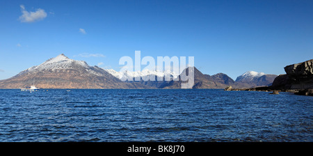 Elgol and Loch Scavaig on the Isle of Skye, Scotland, with fantastic views across to snow capped Cuillin mountains in Spring Stock Photo