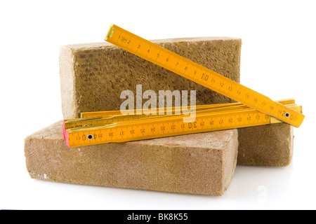 Bricks for building a house and measuring tool Stock Photo