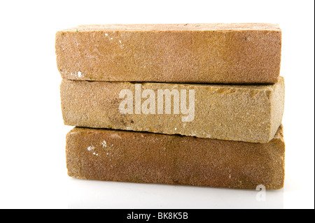 Three stacked bricks to build a house or wall Stock Photo