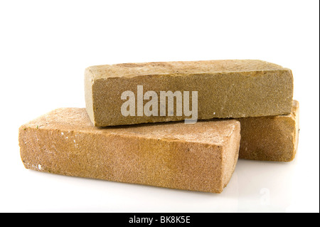 Three bricks stacked and isolated over white Stock Photo