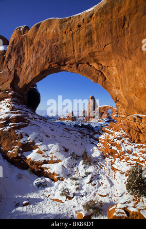 Turret Arch is viewed through the North Window in Arches National Park, Utah. Stock Photo